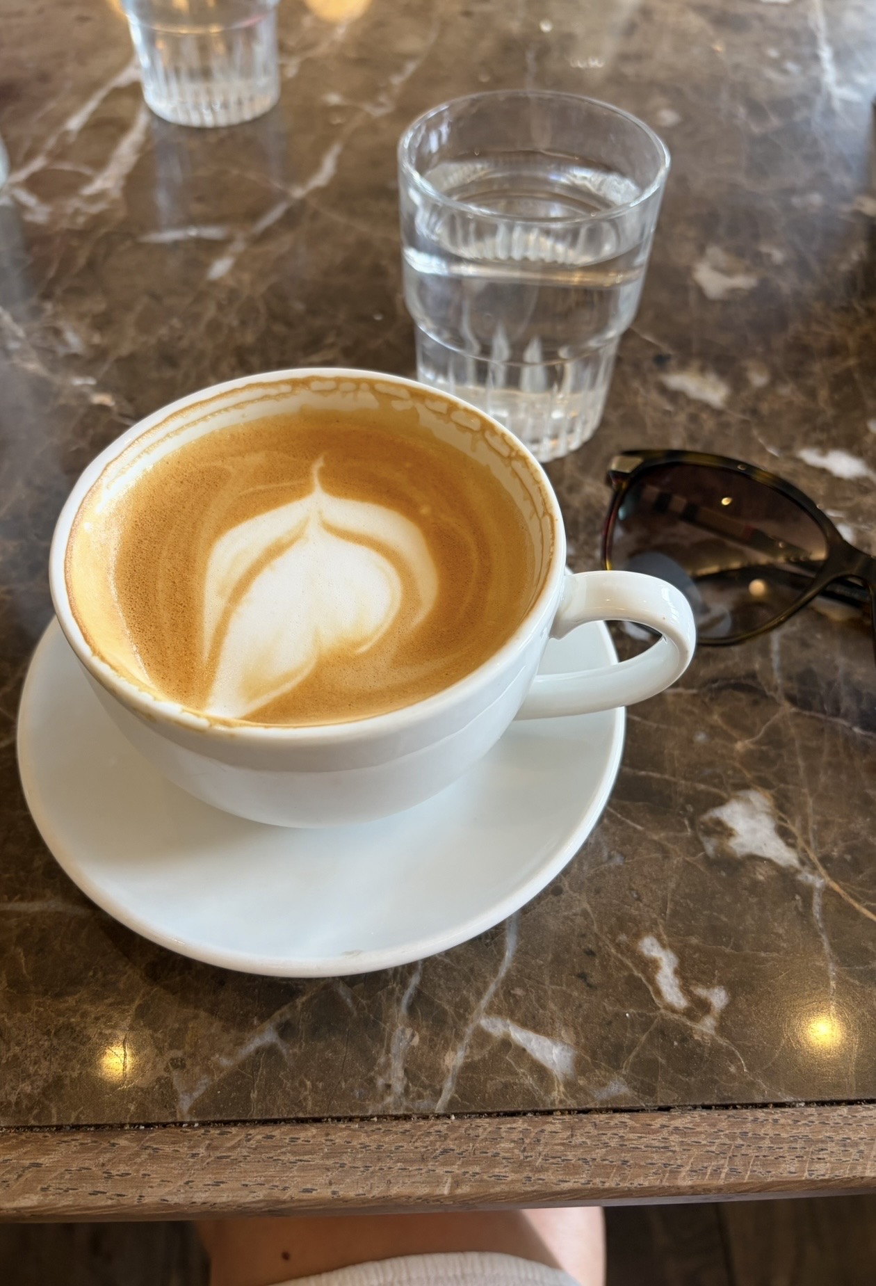 A coffee on a marble table